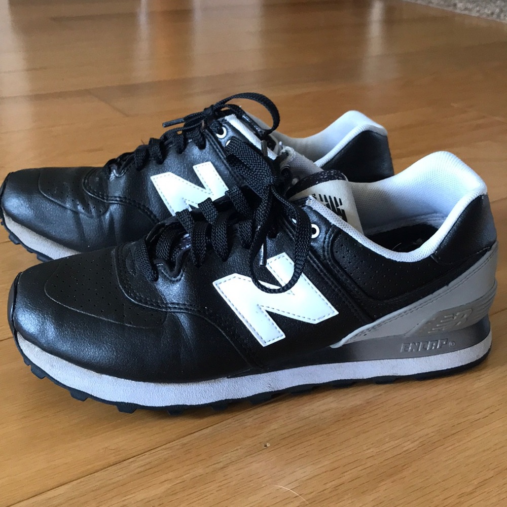 Black leather New Balance tennis shoes